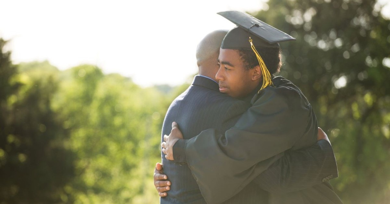 graduate student graduation family parent hugging future