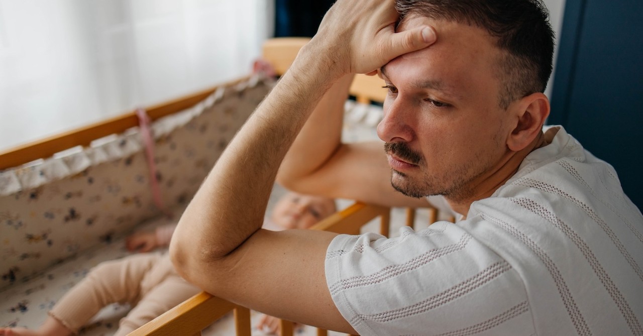 Depressed sad new dad newborn tired